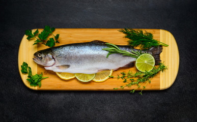 Raw Trout Fish Prepared for Cooking and on Wooden Copping Board
