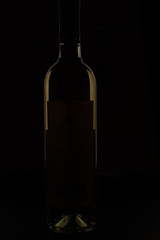 bottle of wine on black background