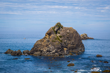 Large boulder among the waves in the sea. Coastal Trail Hidden Beach Section, Redwoods National Park