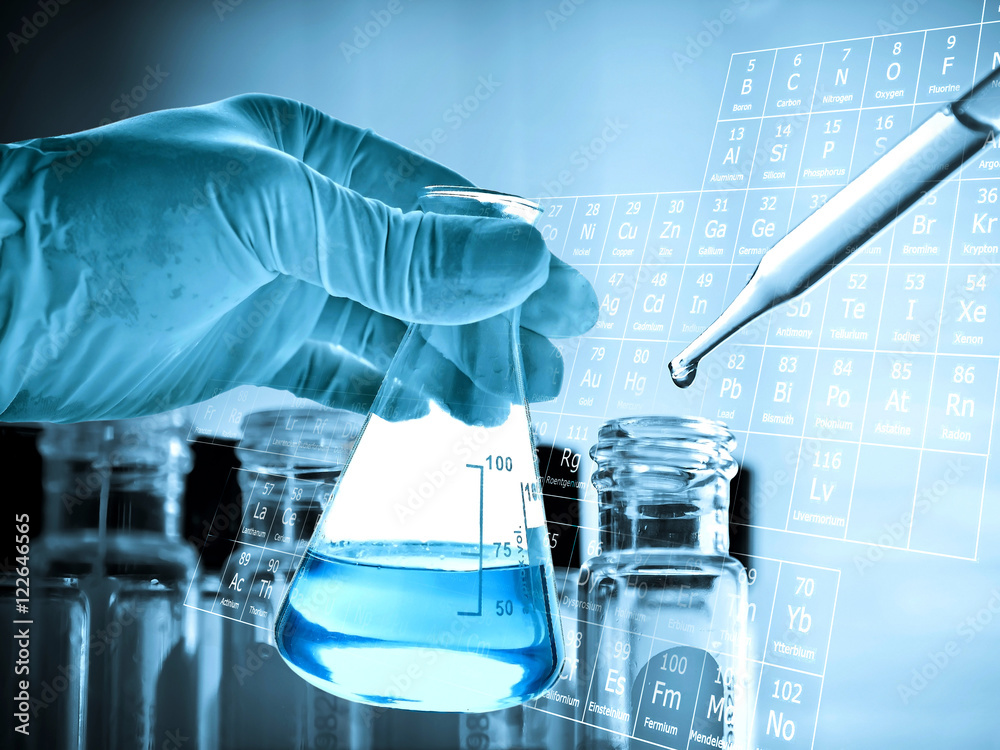 Wall mural flask in scientist hand with laboratory glassware background