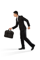 Businessman walking carrying