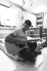 Man play guitar in living room - 122646991