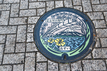 Metal sewer manhole at Kawaguchiko