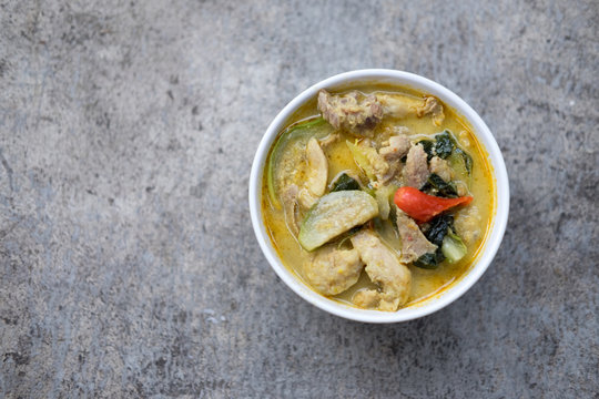 Thai food green curry pork in white bowl