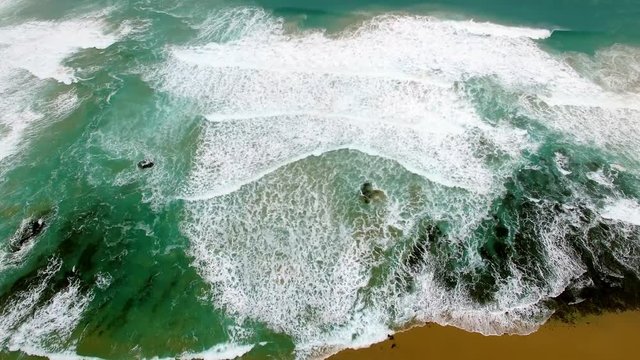 Static aerial view of crushing ocean waves. Great Ocean Road, Victoria, Australia