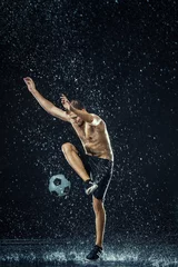 Foto op Canvas Water drops around football player © master1305
