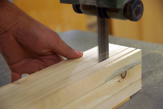 Carpenter working on the band saw