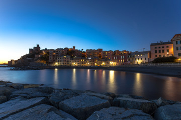 Long exposure in the sea village at night with color houses/ Genoa/Italy/reflexes/lights/ night