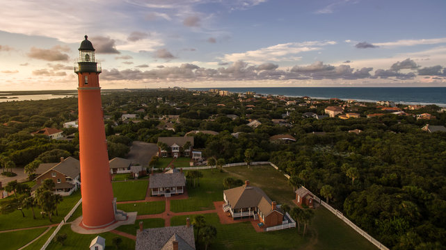 Aerial picture of lighthouse during sunset on Florida beach