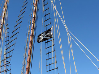 The Skull and Crossbones in the rigging of a tall ship.