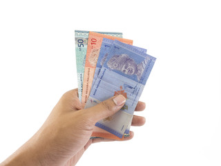 Hand holding Malaysian Ringgit money