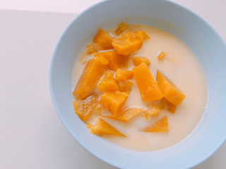 yellow pumpkin sliced in sweet coconut milk. Thai style dessert