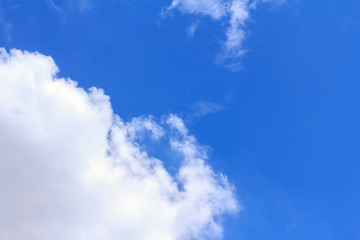 Obraz premium Blue sky background with white clouds. The vast blue sky and clouds sky on sunny day. White fluffy clouds in the blue sky.