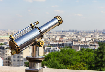 Touristic telescope overlooking Paris from Montmartre hill. Pari