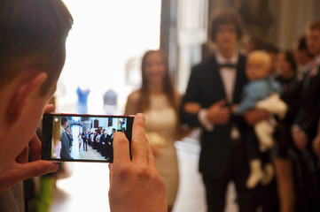 Wedding guest taking photos