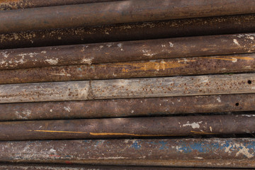 old rusty grungy metal or steel rods or bars in construction structure