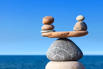Foto op Canvas Concept of harmony and balance. Balance stones against the sea. © Aleksandr Simonov