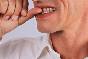 Nail biting , nervous business man, stress concept