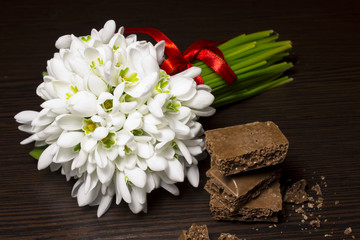 bouquet of snowdrops and chocolate