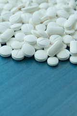 Fototapeta na wymiar Top view of the Spilled white pills