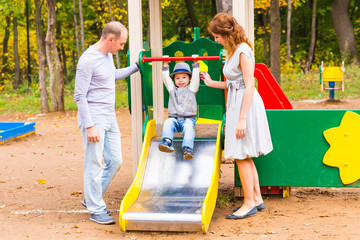 Fototapeta na wymiar Happy little boy on the playground at the day time