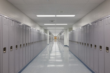 Diminishing perspective of empty locker lined corridor