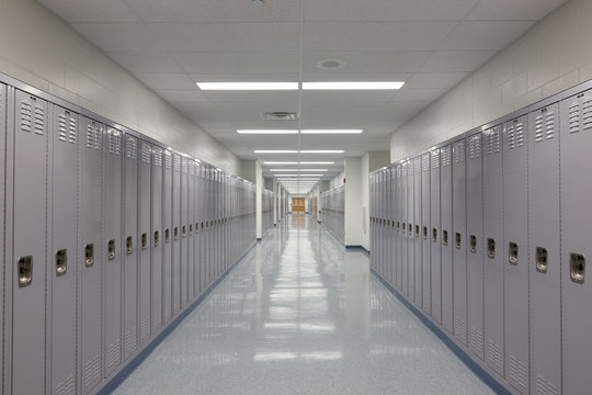 Diminishing perspective of empty locker lined corridor