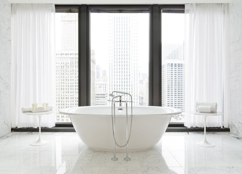 Bathtub in front of window