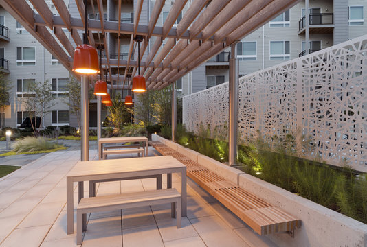 Picnic tables in illuminated outdoor seating area