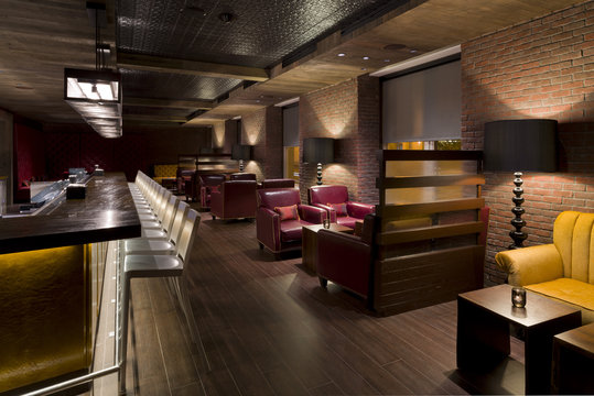 Empty bar with modern leather chairs