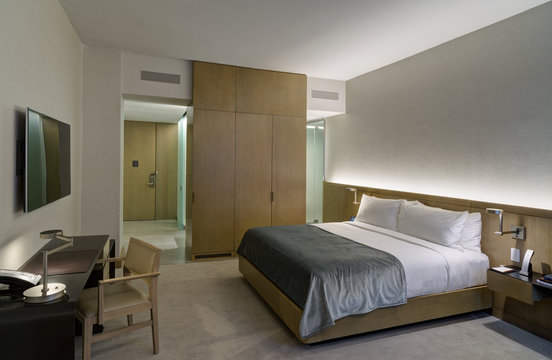 Modern hotel bedroom with double bed