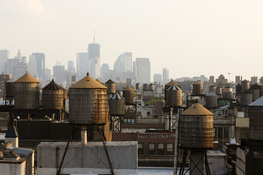 Water towers on roof tops in city