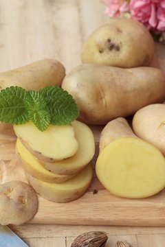 Potatoes raw vegetables with slices for cooking.