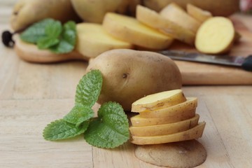 Potatoes raw vegetables with slices for cooking.