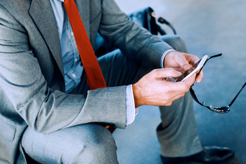 Businessman working on the smartphone