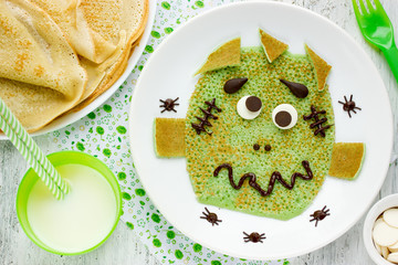 Green pancake - creative idea for funny and healthy breakfast for kids