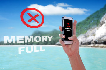 MEMORY FULL showing on the smartphone with tropical island background