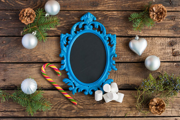 Christmas wooden background with blue frame