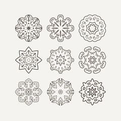 Set of ornate vector mandala symbols. Mehndi lace tattoo. Oriental weave.