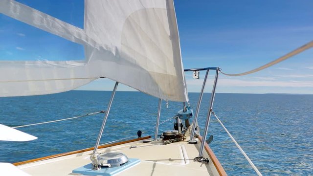 4K Serene Horizon View of Sailboat Sailing, Wind in Sales and Blue Sky and Ocean