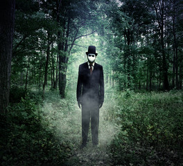 Naklejka premium Evil Tall Man Standing in Scary Woods Alone