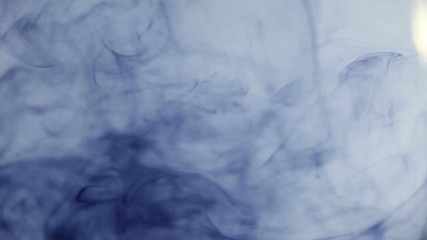 blue ink swirling in water