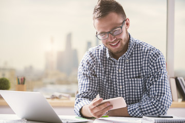 Handsome man using mobile phone