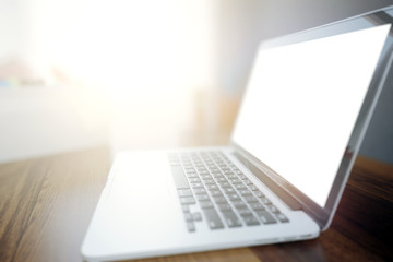 Blank white laptop side