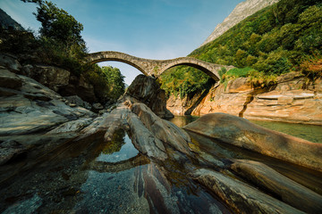 Panoramic Double arch stone bridge at Ponte dei Salti with waterfall, Lavertezzo, Verzasca, Canton Tessin.