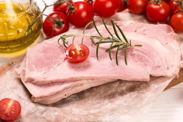 Antipasto catering platter with salami and meat on a wooden background