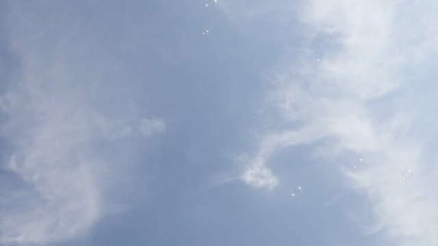 In slow motion soap bubbles floating in the air 1920X1080 FullHD footage - Transparent air balls against blue sky slow-mo 1080p HD video 