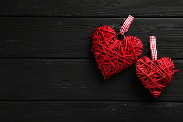 Fototapeta na wymiar Love hearts on a black wooden background