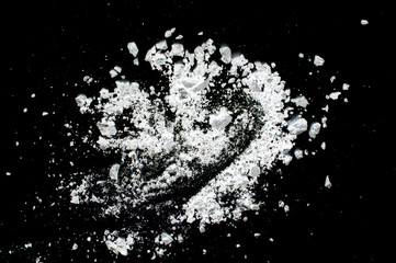 White powder on a black background abstraction