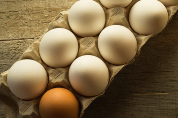Chicken eggs in the package,natural light, top view.